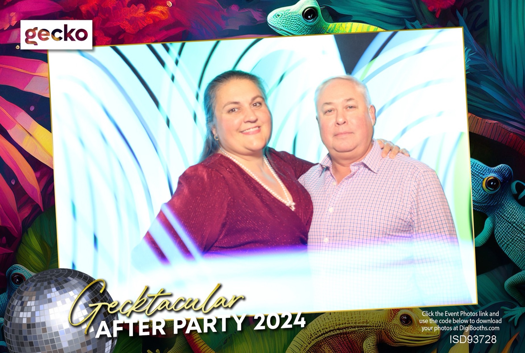 Light-painting booth portrait — a couple wrapped in cool cyan waterfalls of long-exposure light