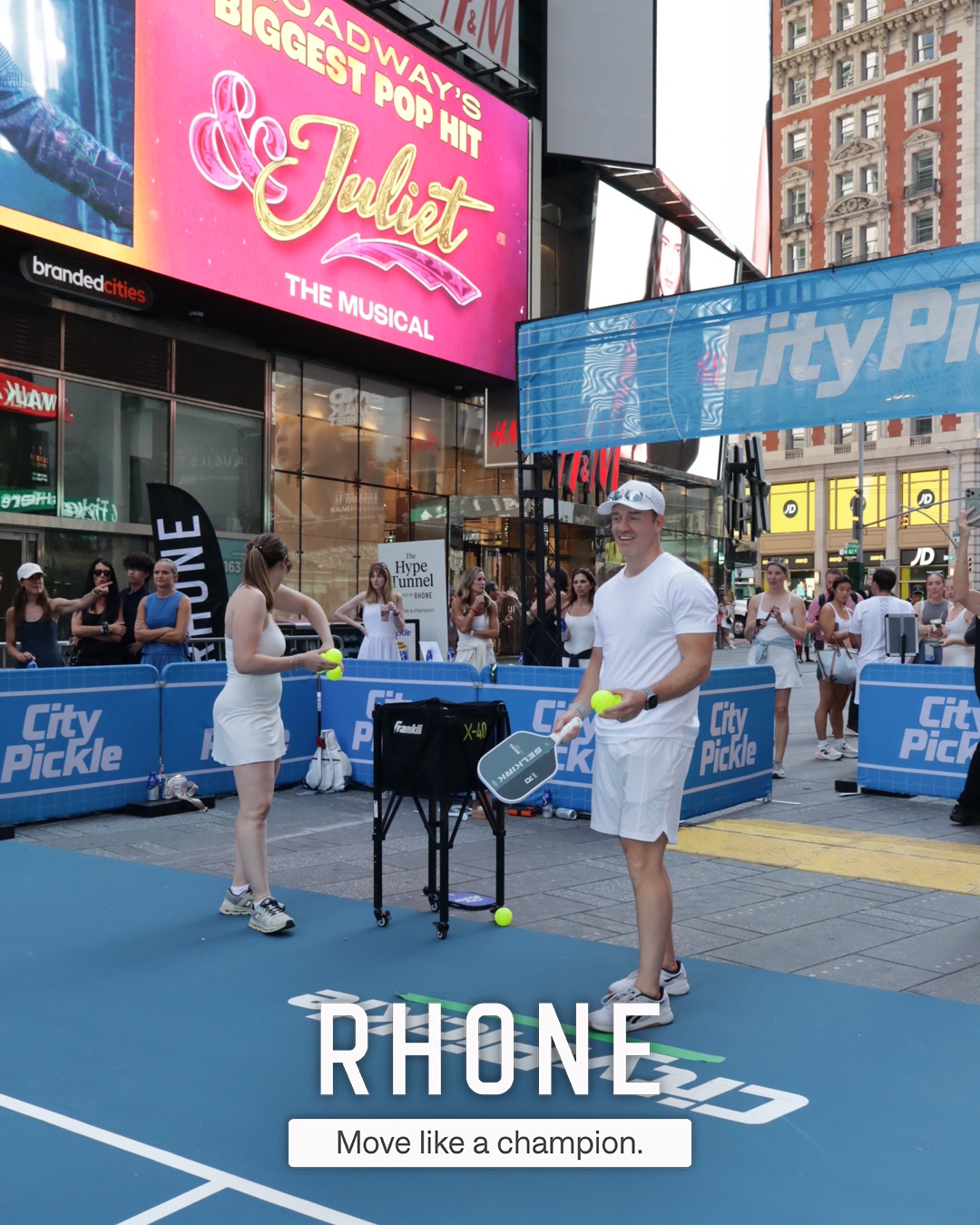 A branded Rhone photo of guests at the CityPicklePalooza activation in Times Square