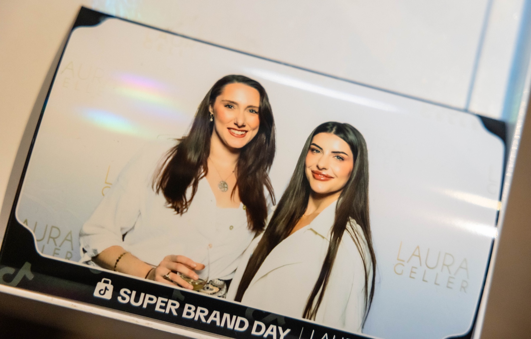 Laura Geller white booth screen output