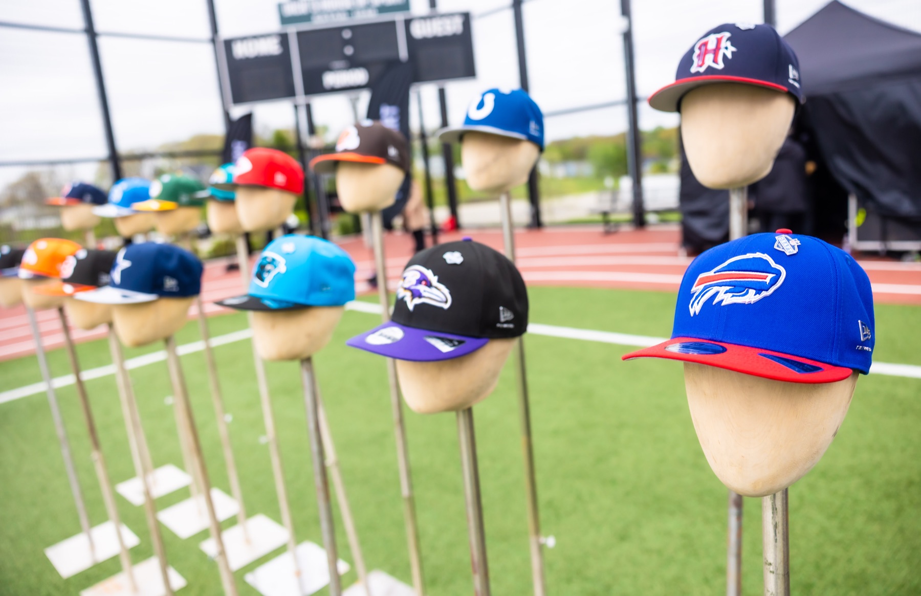 New Era cap display at the activation