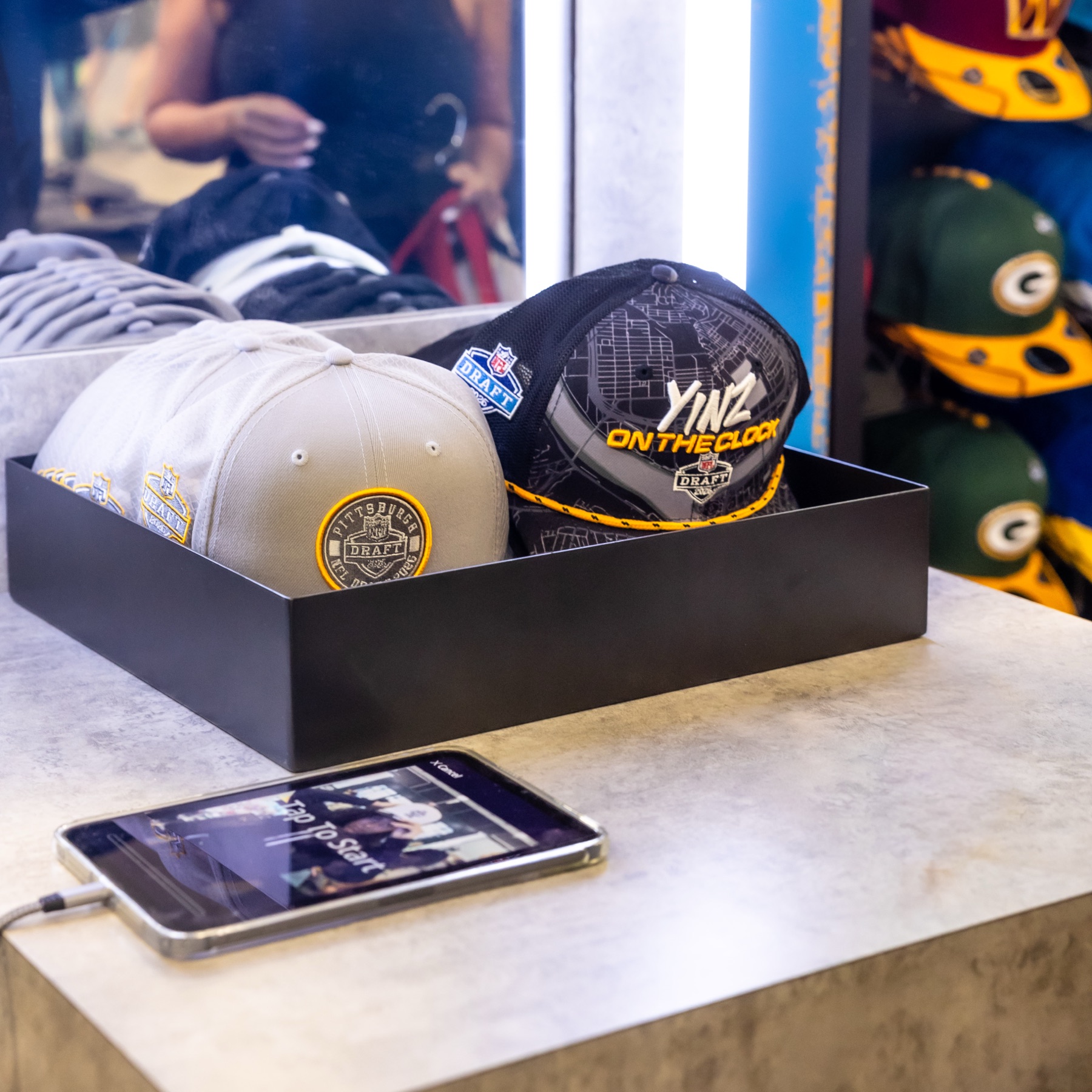 Branded New Era caps at the fan activation