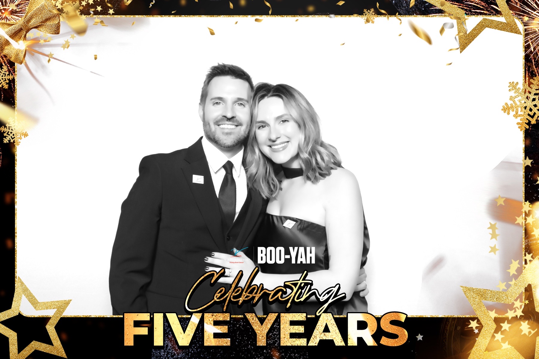 An elegant black-and-white portrait of a couple in formalwear at the V Foundation gala