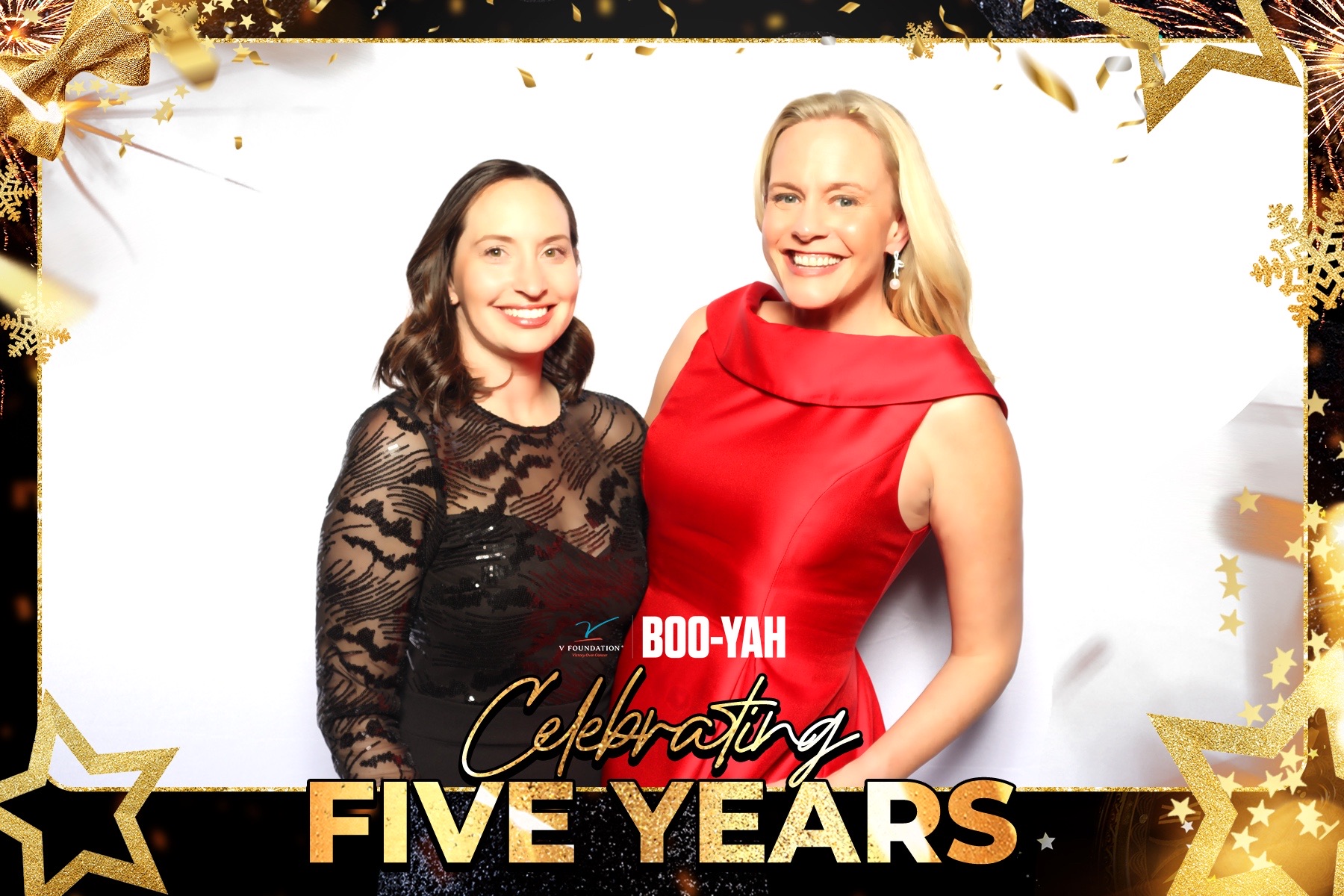 A trio of guests in eveningwear posing together at the V Foundation gala
