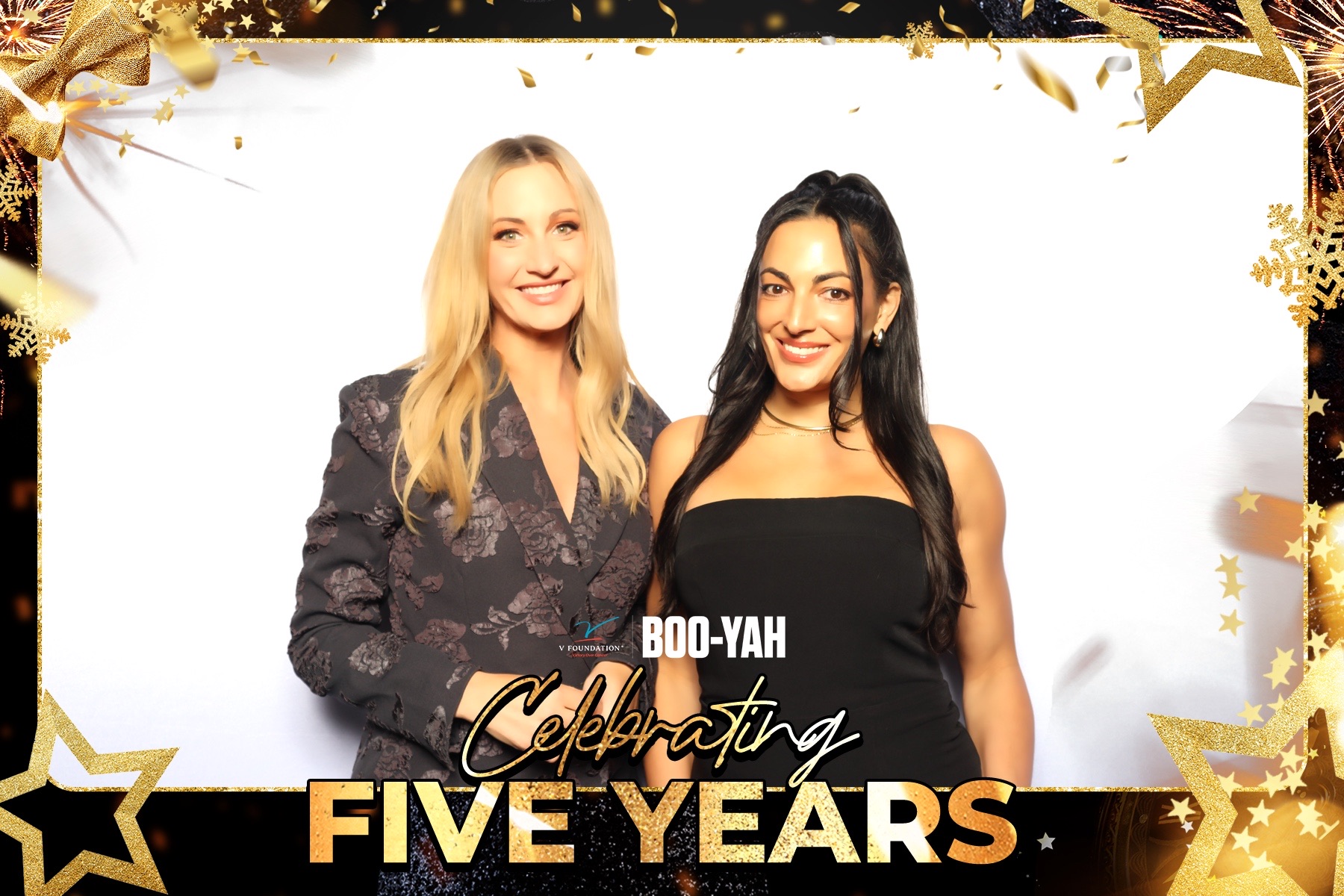 Two guests in elegant eveningwear posing at the V Foundation gala
