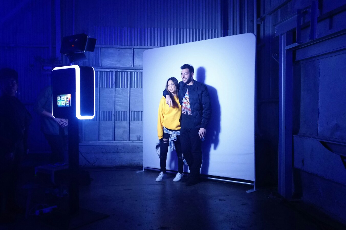 A couple enjoying a photo booth experience