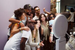 A group of people using a photobooth