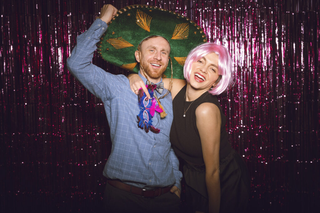 Friends posing for a picture in a photo booth