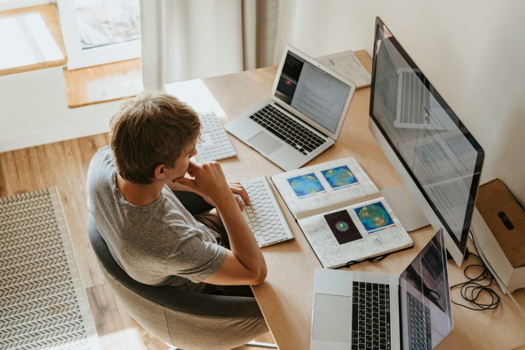 A person is using a desktop to store photobooth videos