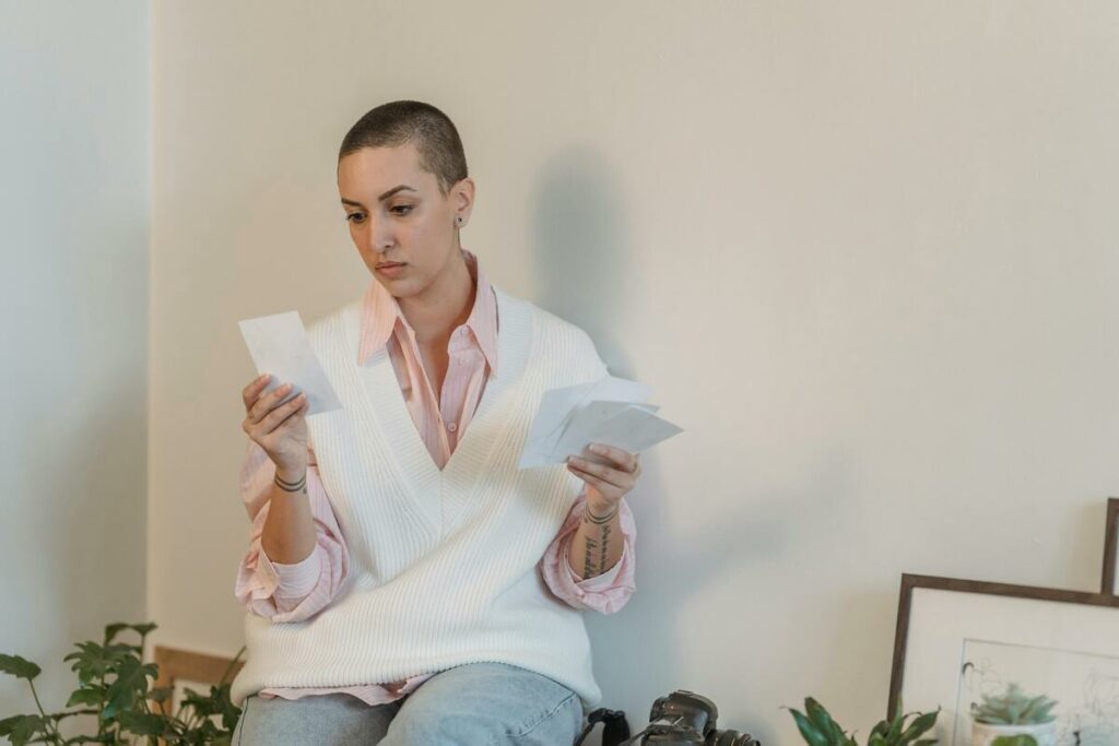 A woman looking at the printed photos from the photo