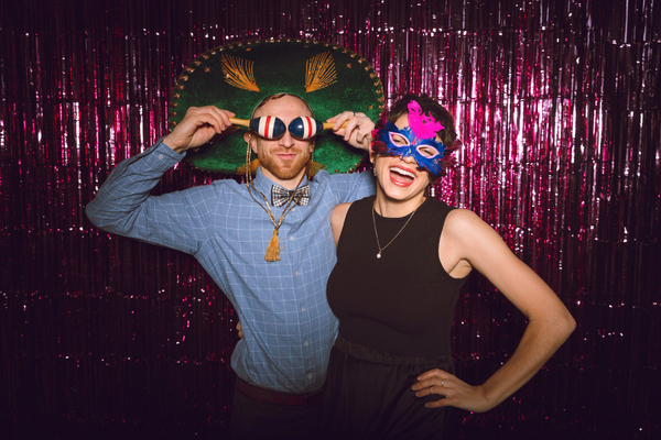 A couple enjoying their photo booth experience