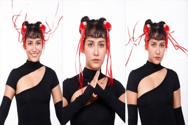 A young girl takes various pictures of her poses to determine her best angle