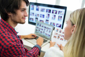 Photobooth business partners discussing the number of images included in different photobooth packages