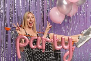 A woman posing in a photo booth cart