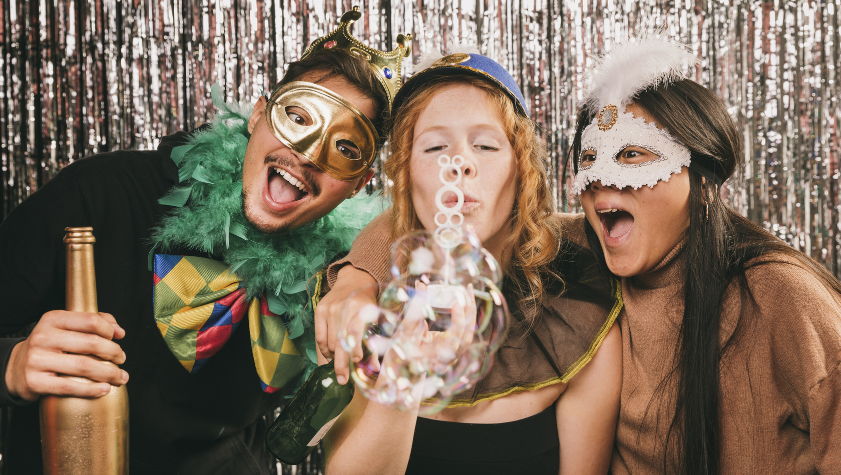 Three people posing for a photo booth picture