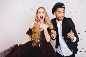 Two people having fun with a corporate photo booth