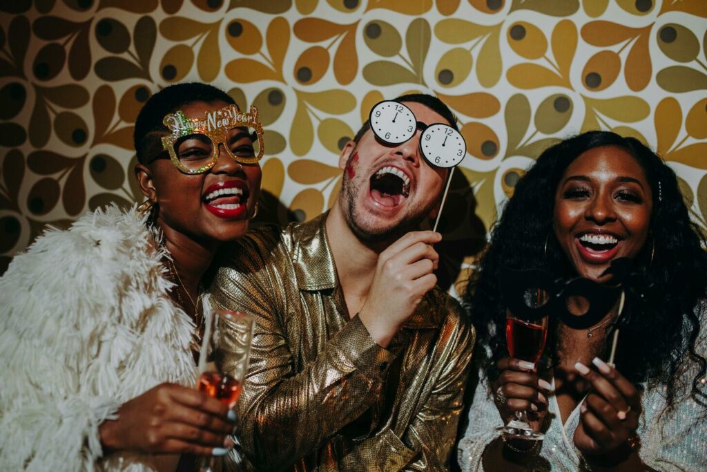 Three people having fun on a photo booth