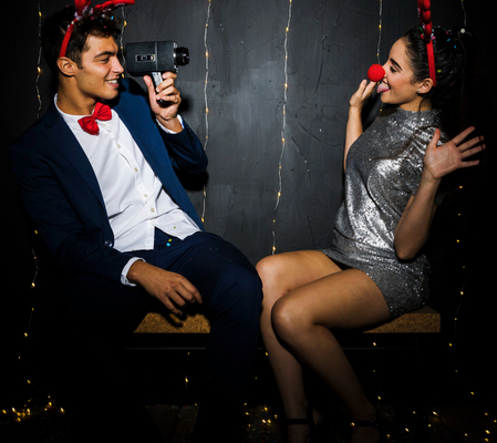 A couple enjoying the Photo Booth