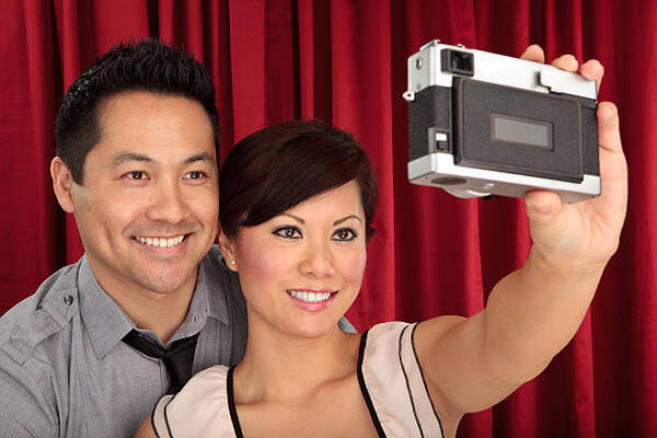 A couple in a Photo Booth