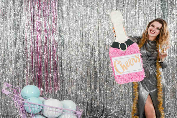 A photo booth with an elegant backdrop for a wedding event