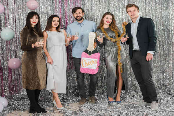 Guests taking a picture in a digital photo booth during an event