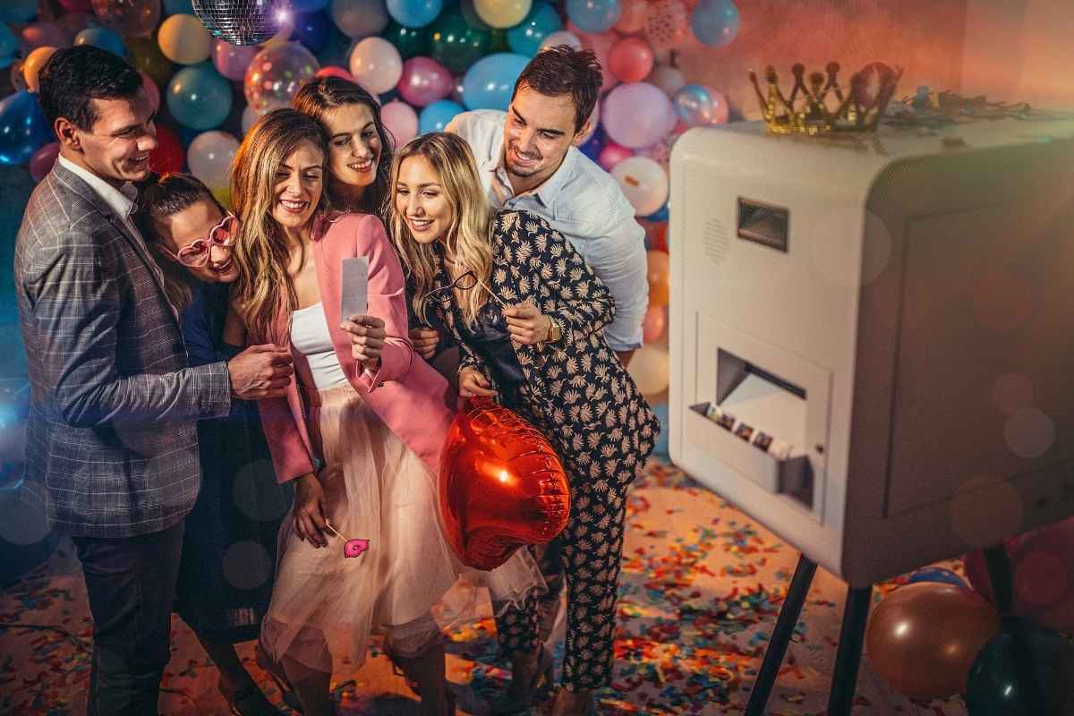 A group participating in a corporate event photo booth rental