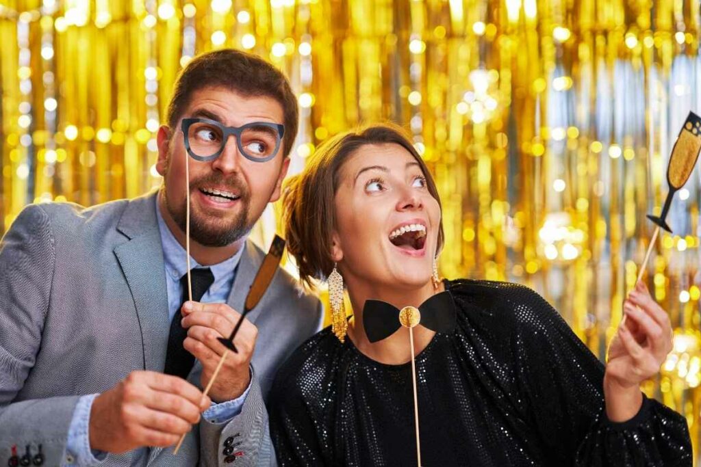 Corporate event hosts in a photo booth rental