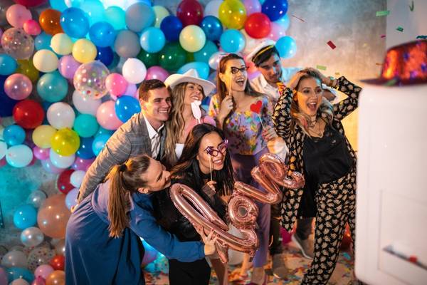 Employees enjoying a photo booth rental in a corporate event