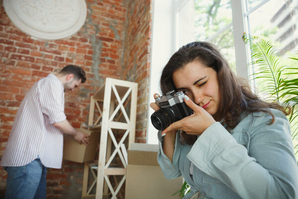 A man storing photos in a dry box container