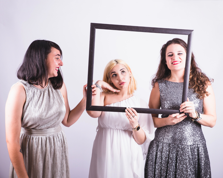 Happy ladies enjoying Selfie Photo Booth