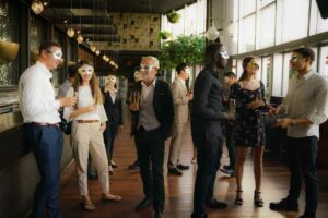 Guests at corporate events with a mask theme