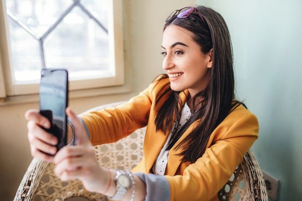 A woman attending a virtual photo booth