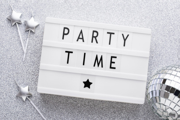 Lightbox sign with "Party Time" text and disco ball.