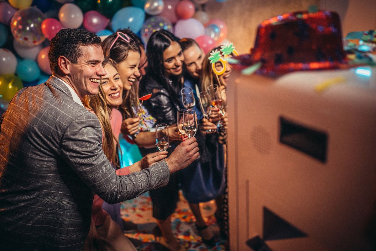 Corporate employees enjoying the photo booth experience during a corporate event