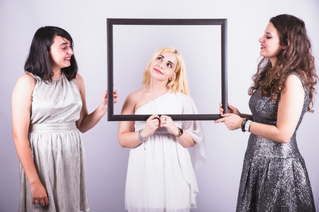 friends enjoying photo booth in a corporate event