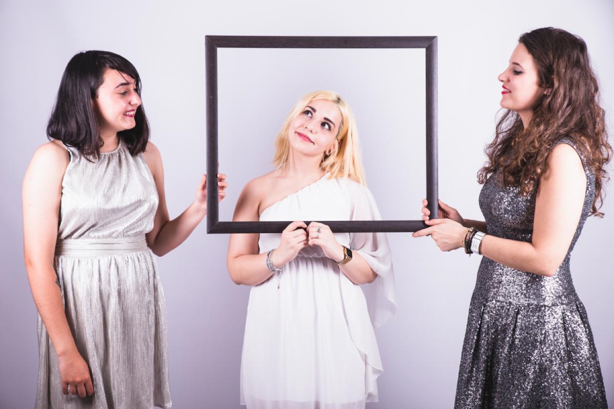 friends enjoying photo booth in a corporate event